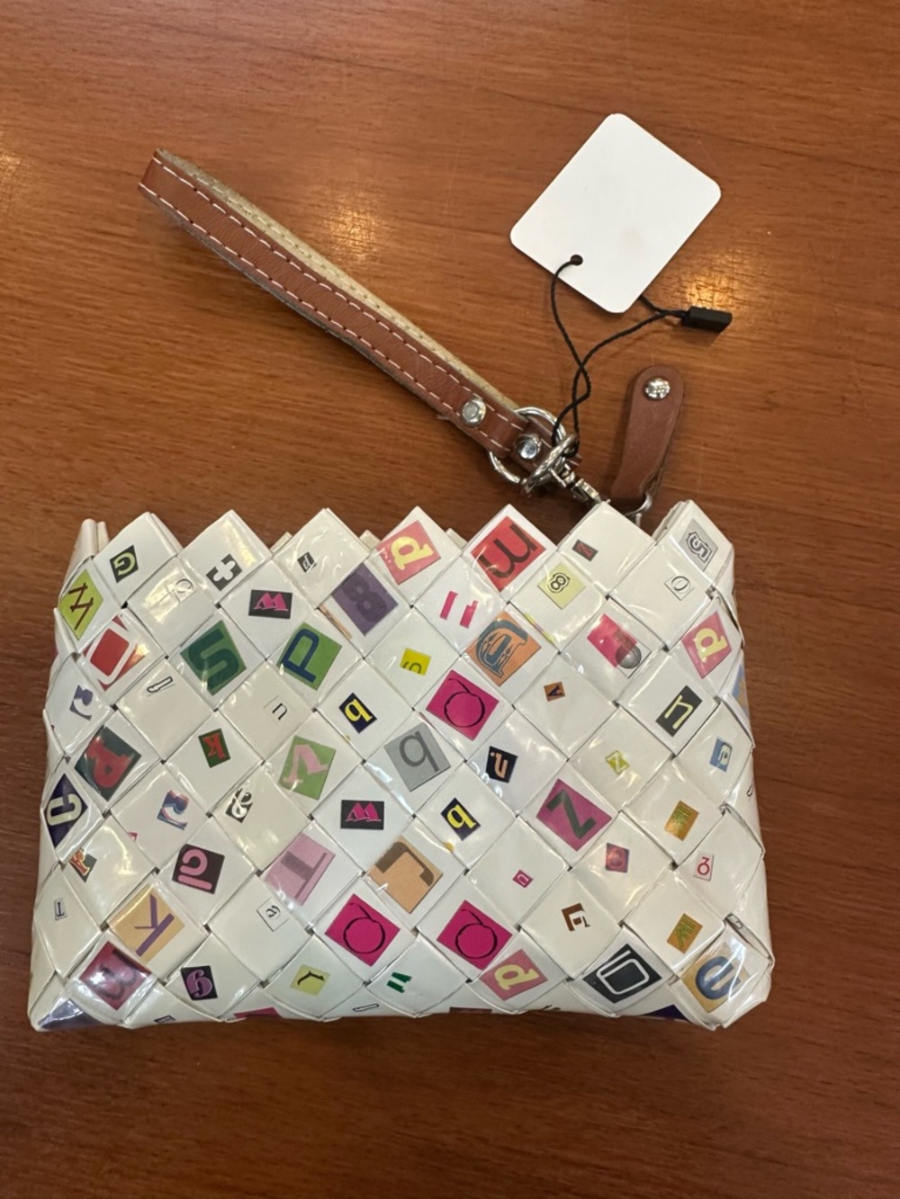 Nahui Ollin White Woven Clutch with Multicolor Letter Accents and Tan Strap